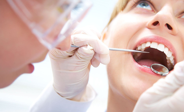 Dentist provides oral care check-up on patient using advanced dental tools Near Kovilpalayam.